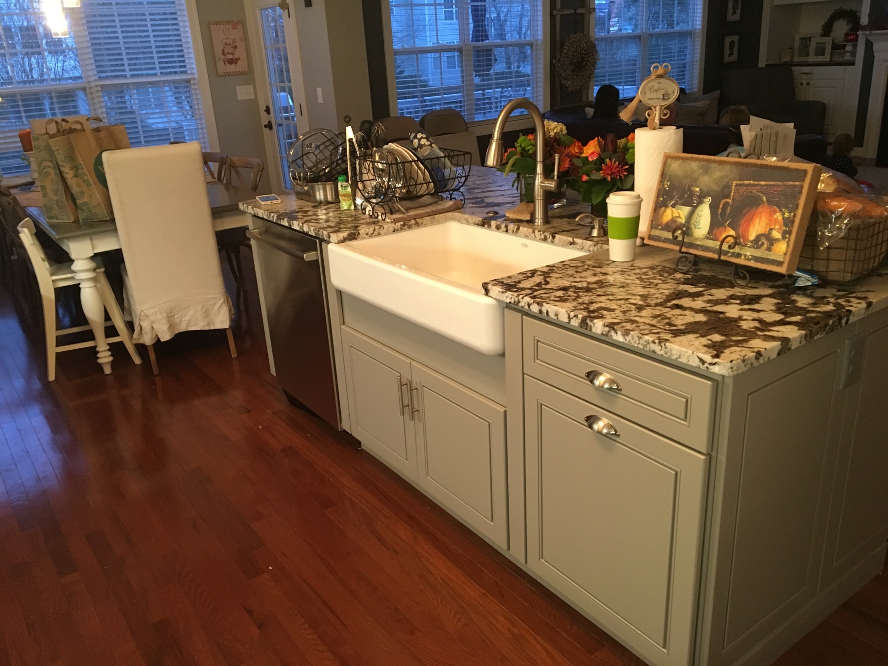 Kitchen island with farmhouse sink and custom granite