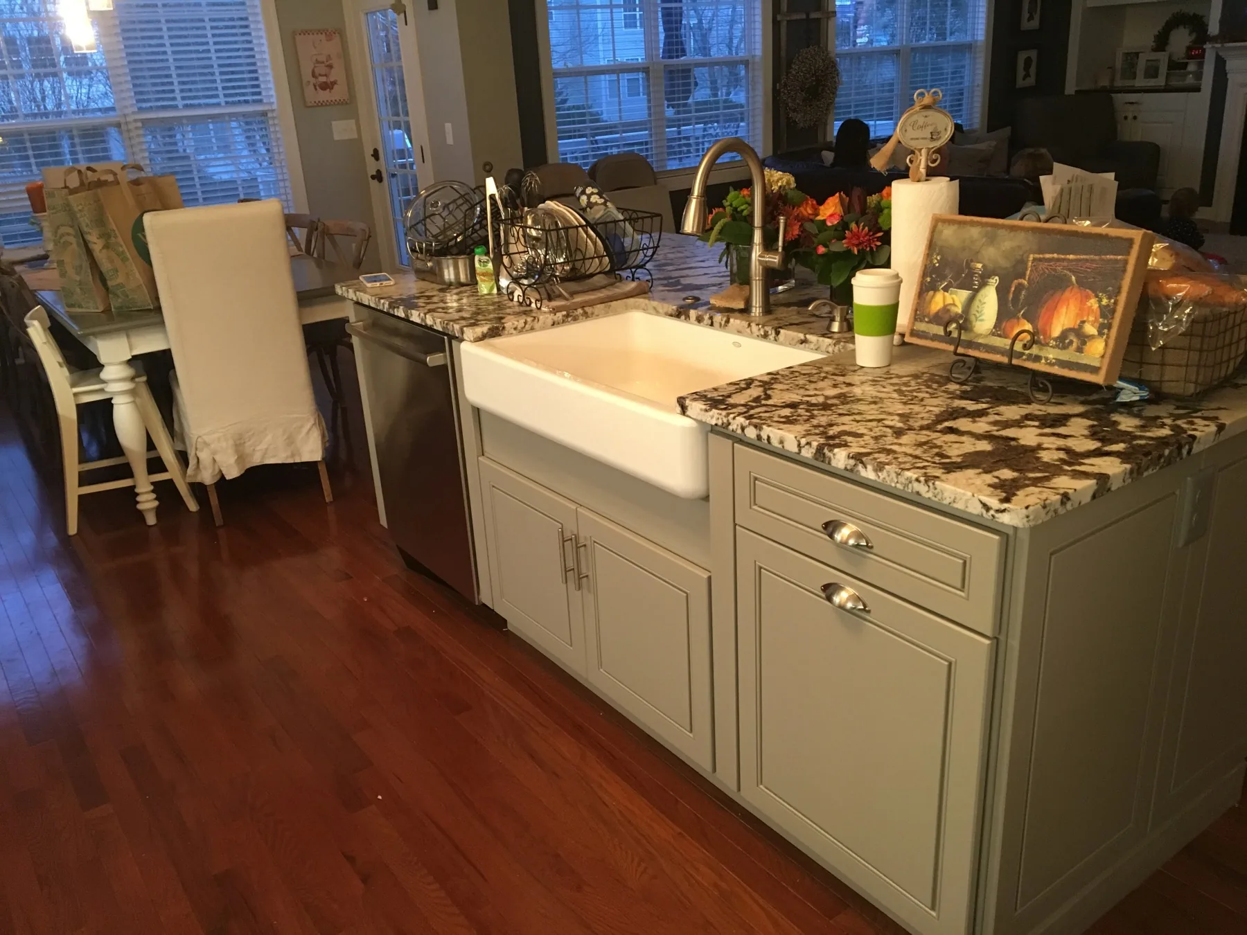 Kitchen island with farmhouse sink and custom granite